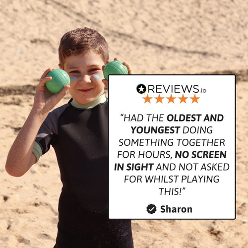 A girl stands outdoors holding a boules ball, with product/brand information overlaid on the image. 