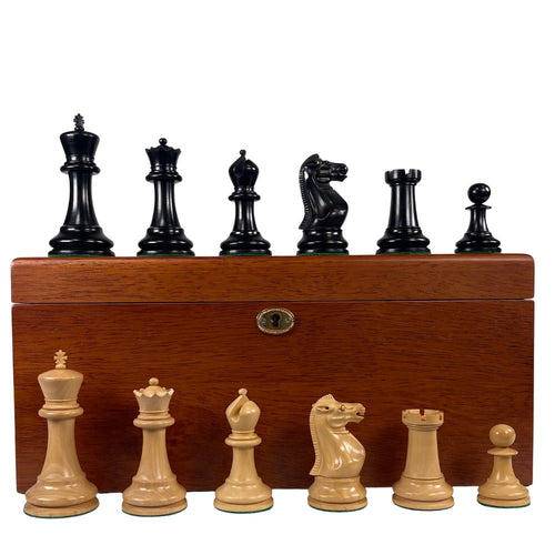 Wooden chess pieces with a wooden box on a white background