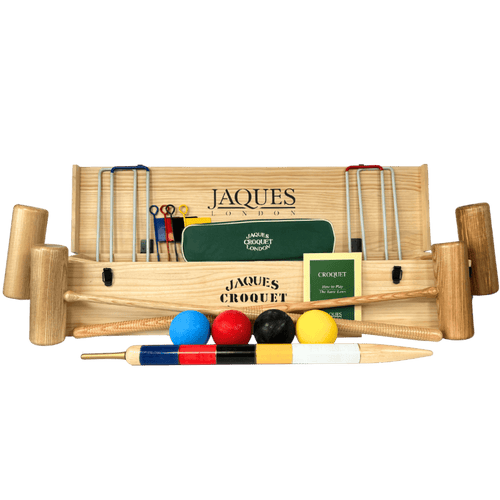 Croquet set with wooden mallets, balls, and a green hoop on a transparent background