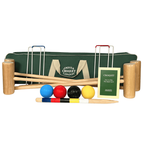Croquet set with wooden mallets, balls, and a green carrying bag on a white background 