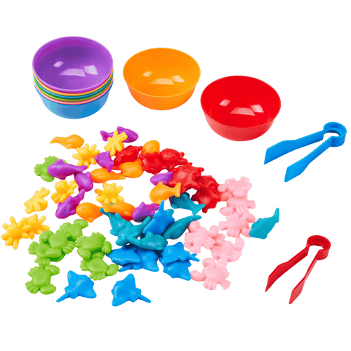 Colourful plastic toys including bowls, tongs, and sea creature figures on a clear background [fill]