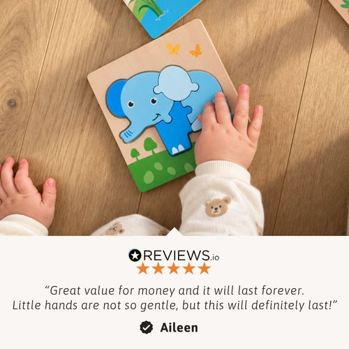 A baby's hands holding a wooden elephant puzzle on a light wood floor, with a review quote and star rating overlay at the bottom.