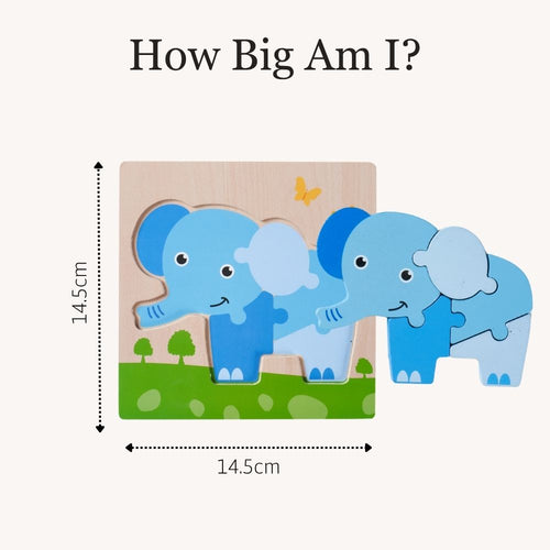 A wooden children's puzzle showing two blue elephants on a green grassy background, with measurement arrows and text reading 14.5cm and 'How Big Am I?' on a light beige background.