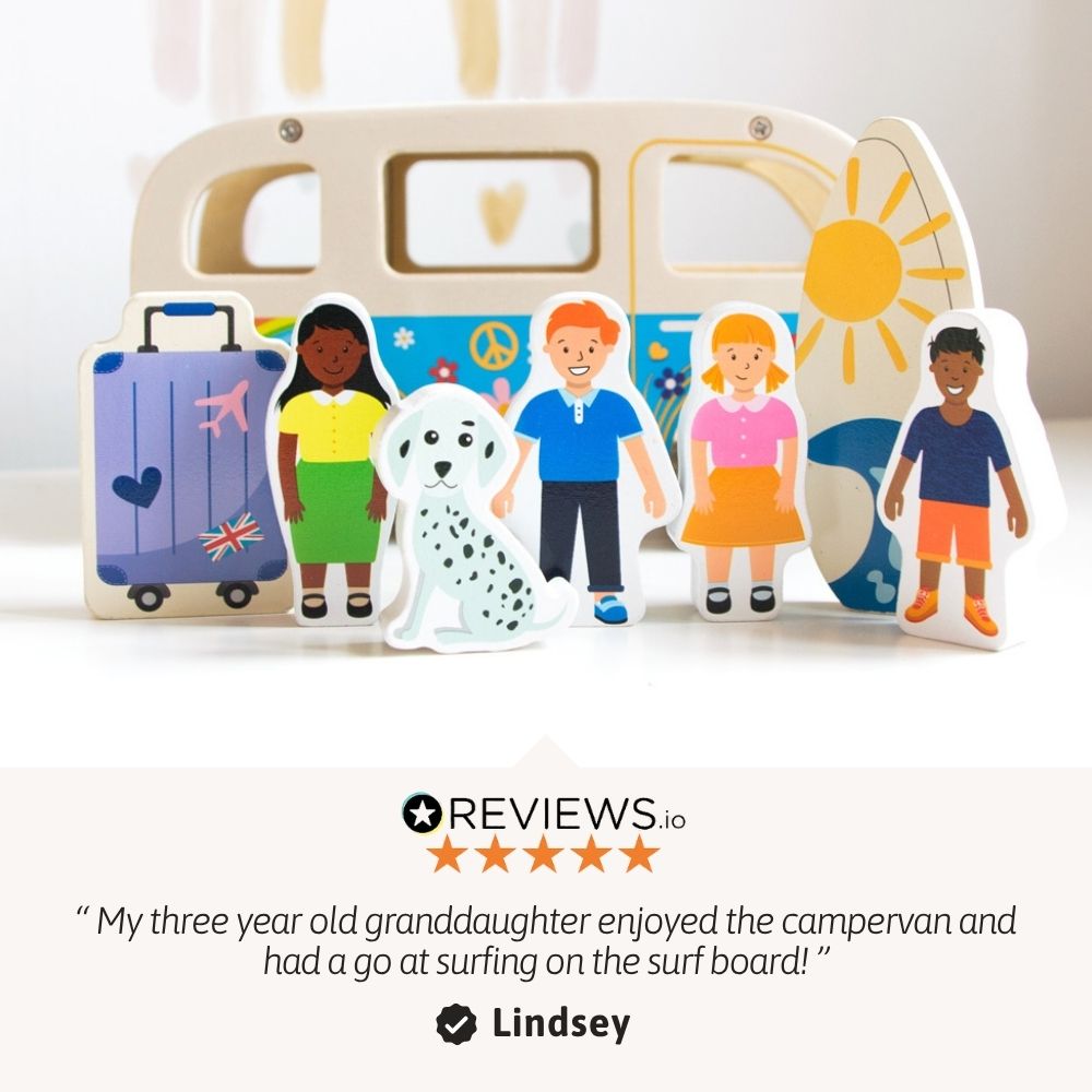 Wooden children's travel-themed toy set featuring a cream-colored camper van, a purple suitcase, a white dalmatian, and five colorful cartoon children and a sun, displayed on a white surface with a customer review quote below. 