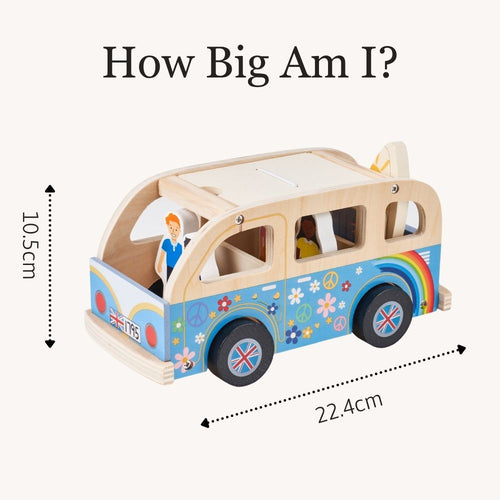 A wooden toy van with colorful retro-style decals, shown with measurement arrows and text reading 'How Big Am I?' and dimensions 10.5 cm height and 22. 