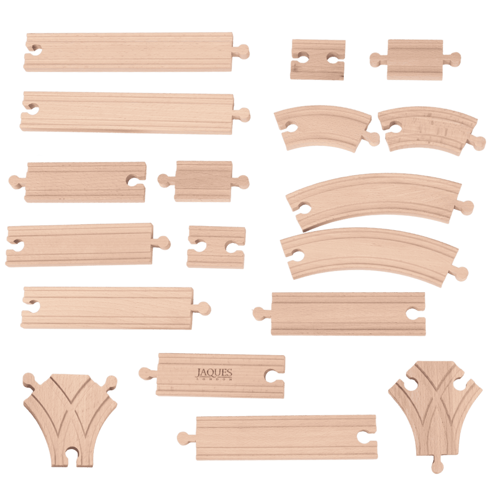 Set of wooden train tracks on a green background 