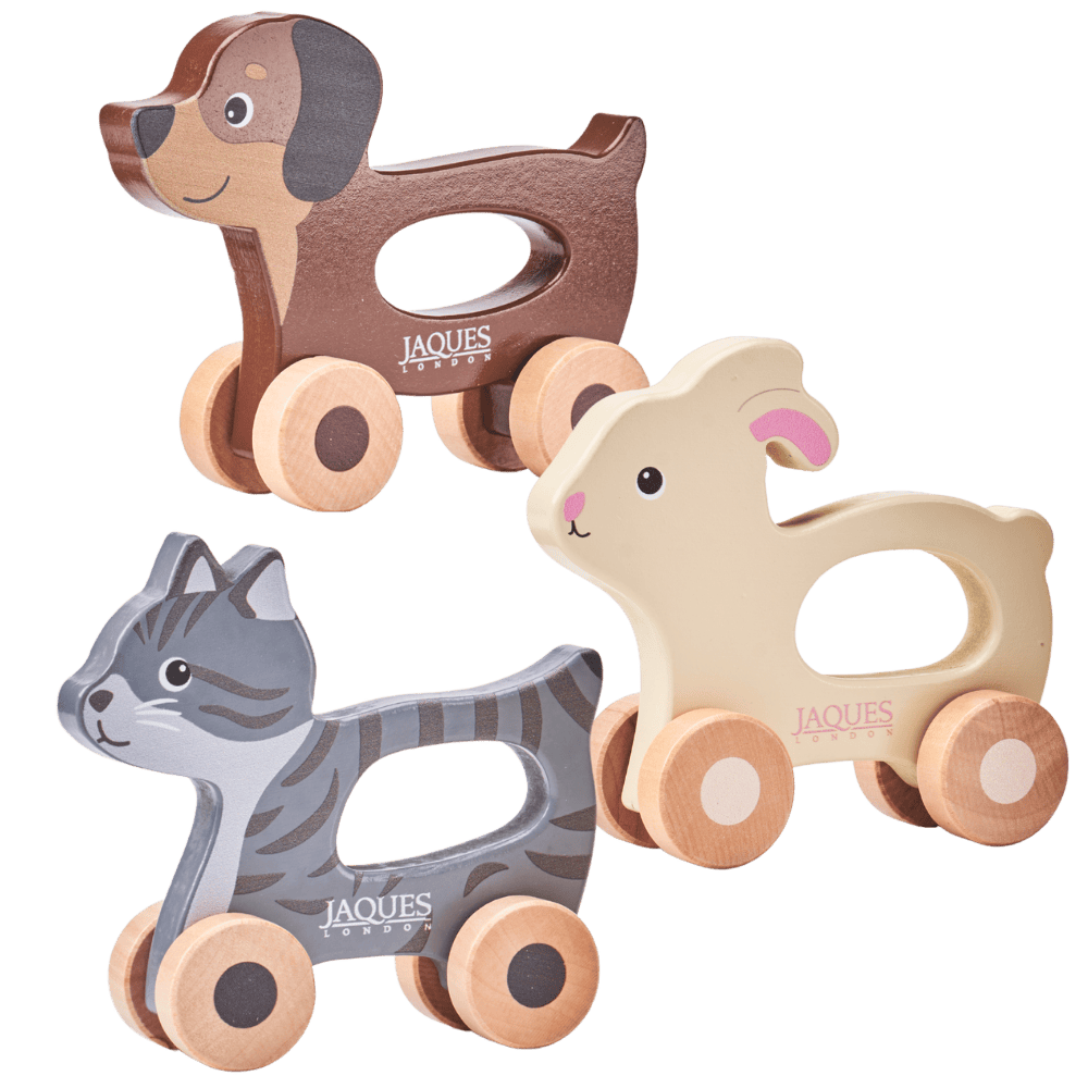 Three wooden animal toys with wheels on a transparent background, featuring the brand 'Jaques'. 