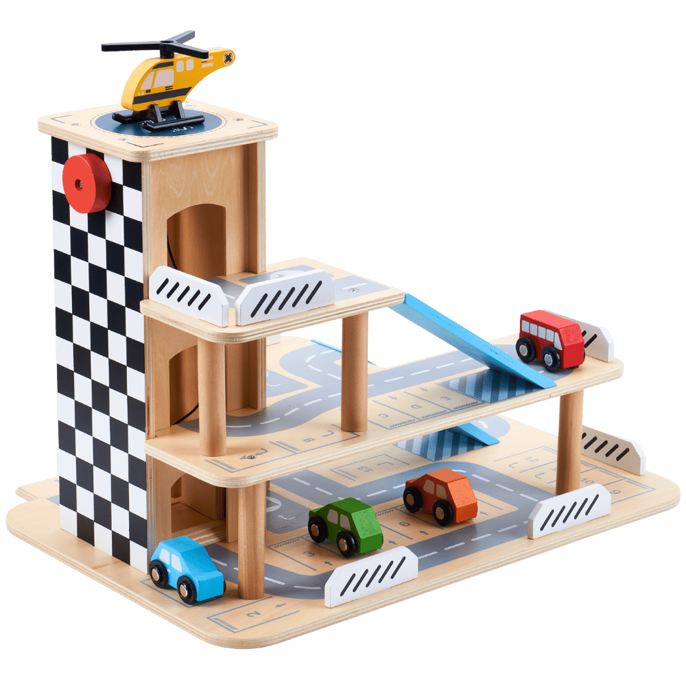 A wooden toy garage playset with a checkered tower, ramps, roads, and small toy cars and a helicopter, shown on a solid green background.
