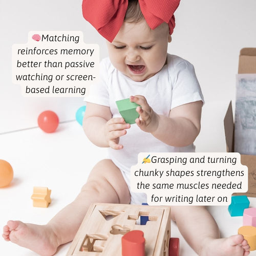 Close-up of little hands grasping colourful wooden shapes, strengthening fine motor skills through hands-on play. 