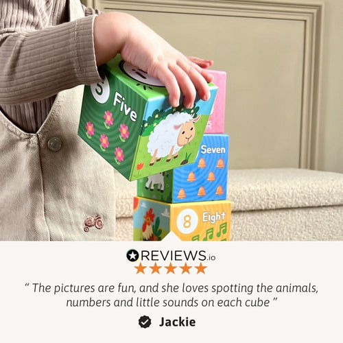 Child playing with educational number blocks, with a review quote from Jackie at the bottom. 