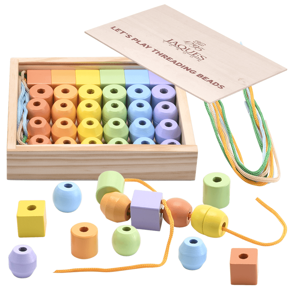 Pastel threading beads in storage box