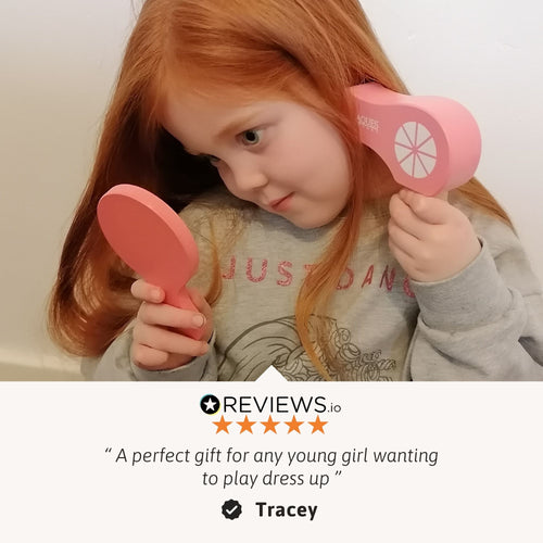 Child holding pink shoes with a review overlay