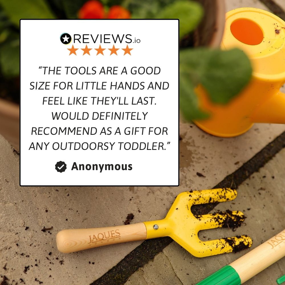 Yellow gardening tool on a sandy surface with a five-star review card overlay.