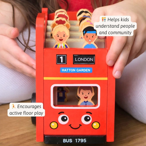 Toy bus with figurines on a wooden surface, labelled 'London Hatton Garden', with text indicating benefits for children. 