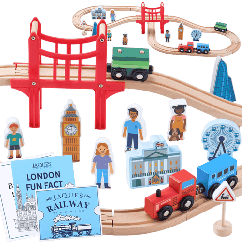 Toy train set with wooden tracks, bridges, and miniature buildings on a black background [fill]