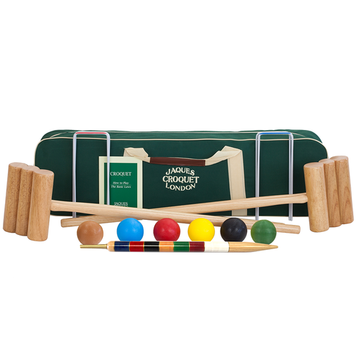 A croquet set displayed on a white background, including wooden mallets, pointed sticks, colored balls, a striped cue, and a green carrying case with a Jacques Croquet London label. [fill]