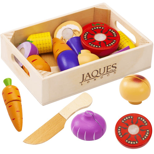 Wooden fruit and veg in wooden crate with knife