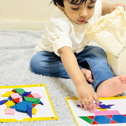  child playing with the puzzles