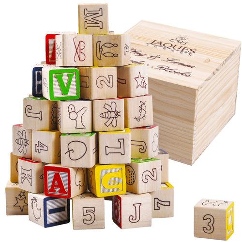 Educational blocks next to wooden storage box