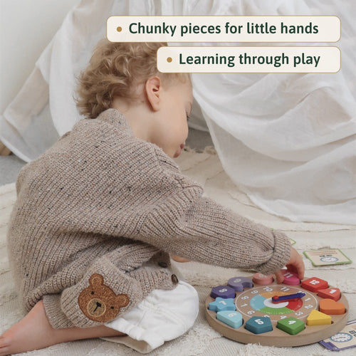 Toddler playing the Jaques wooden clock, chunky pieces for little hands, learning through play 