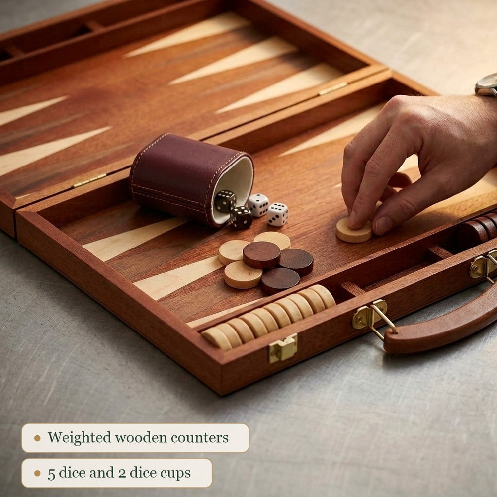 Close up of the Jaques mahogany backgammon board, counters, brass and dice cup 