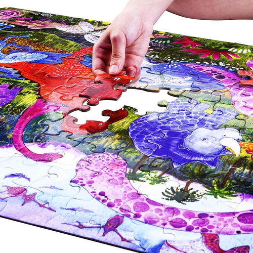  Hand placing dinosaur jigsaw piece