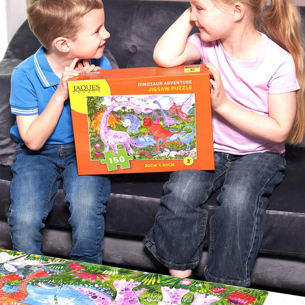  Kids holding dinosaur puzzle box 