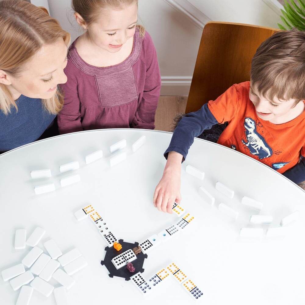 Great family board game-Mexican Train Dominoes-Family playing Mexican train dominoes in lounge-56136 