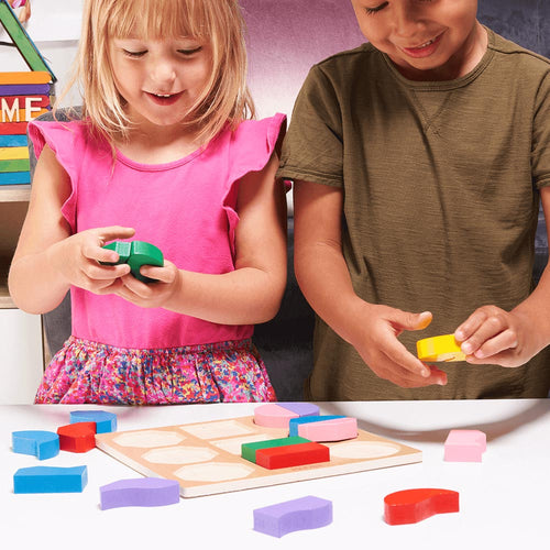  Children using shape sorting board 