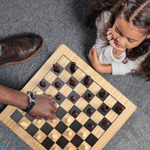  Family chess set set with Staunton chess pieces - girl playing with Dad 