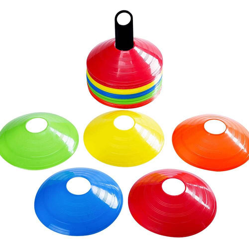  Green, yellow, orange, blue and red training cones scattered around the stack