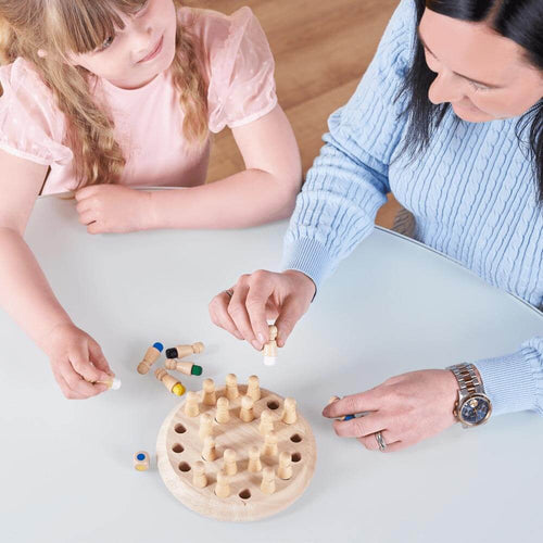   Wooden memory game - Mum and daughter playing the memory game 